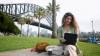 Girl smiling with bridge behind her in Australia