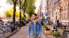Guy walking the streets of Amsterdam